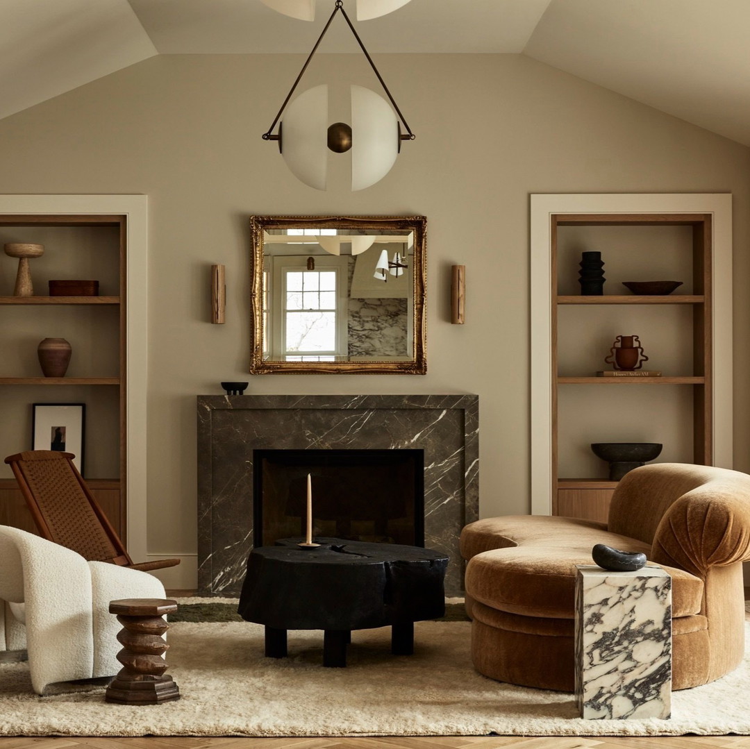 a living room filled with furniture and a fire place