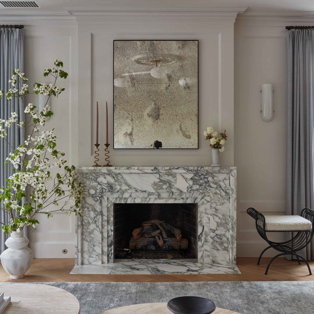 a living room filled with furniture and a fire place