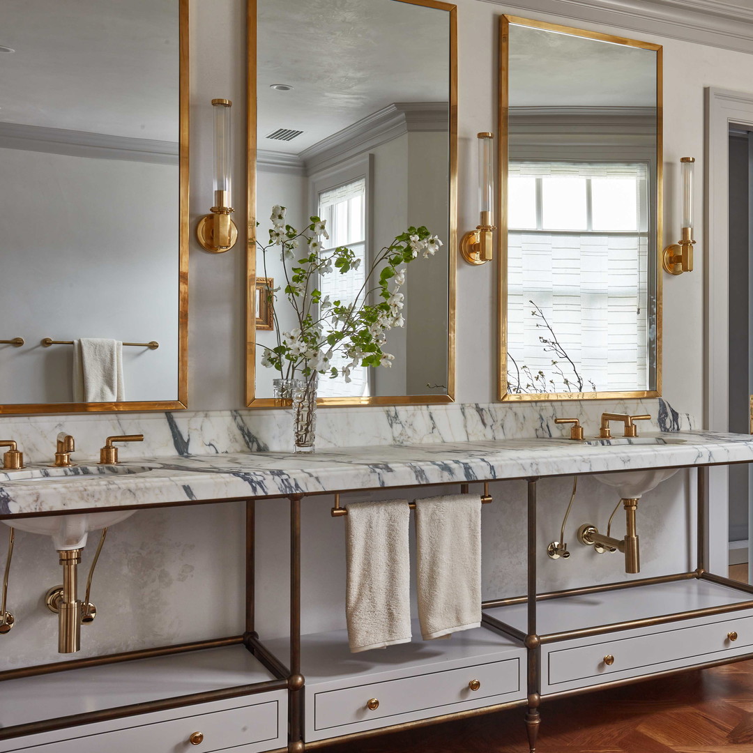 a bathroom with two sinks and a large mirror