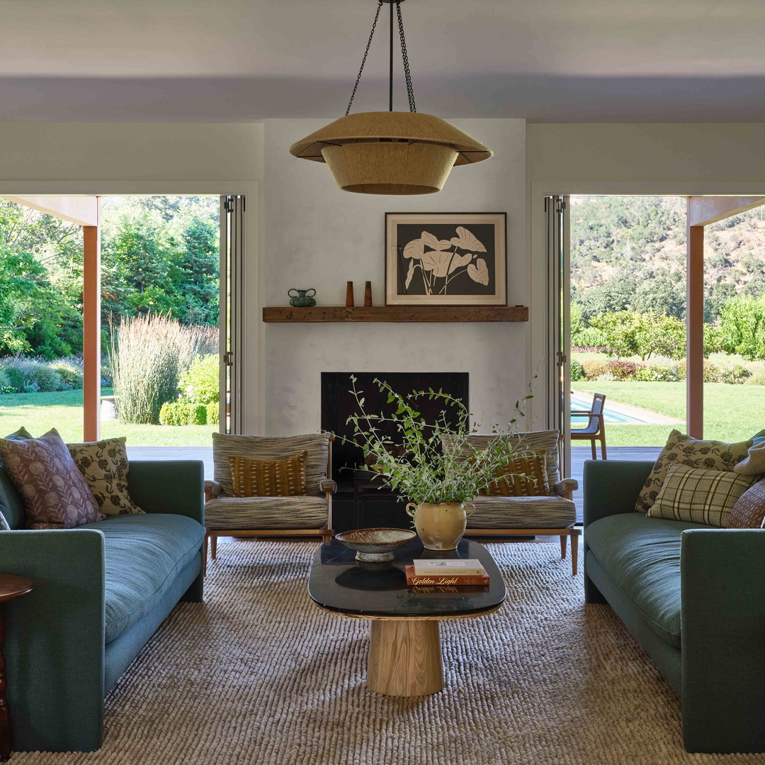 a living room filled with furniture and a fire place