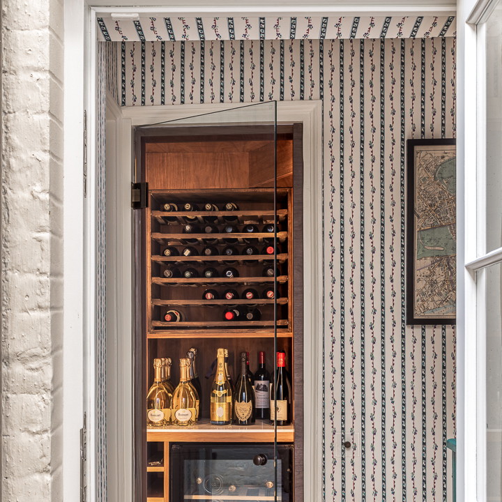 a room with a wine rack and wine bottles