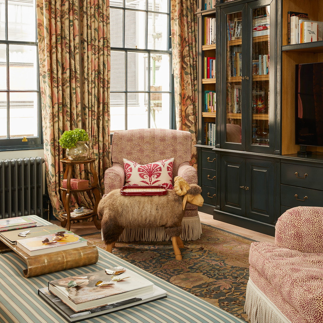 a living room filled with furniture and a large window