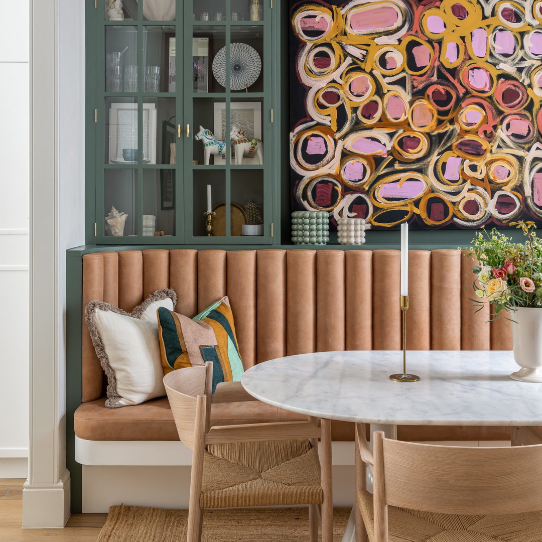 a dining room with a table and chairs