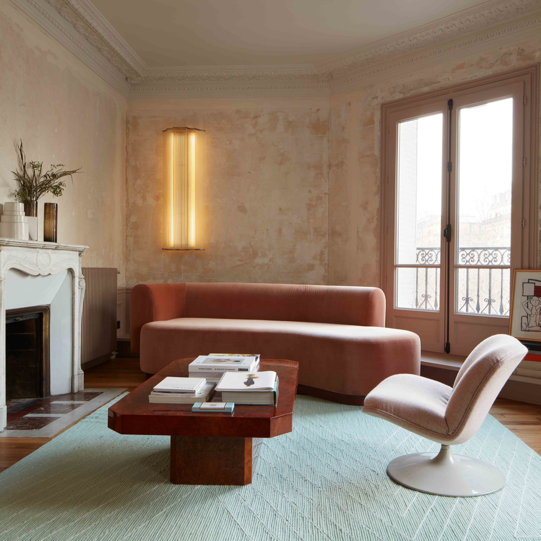 a living room filled with furniture and a fire place