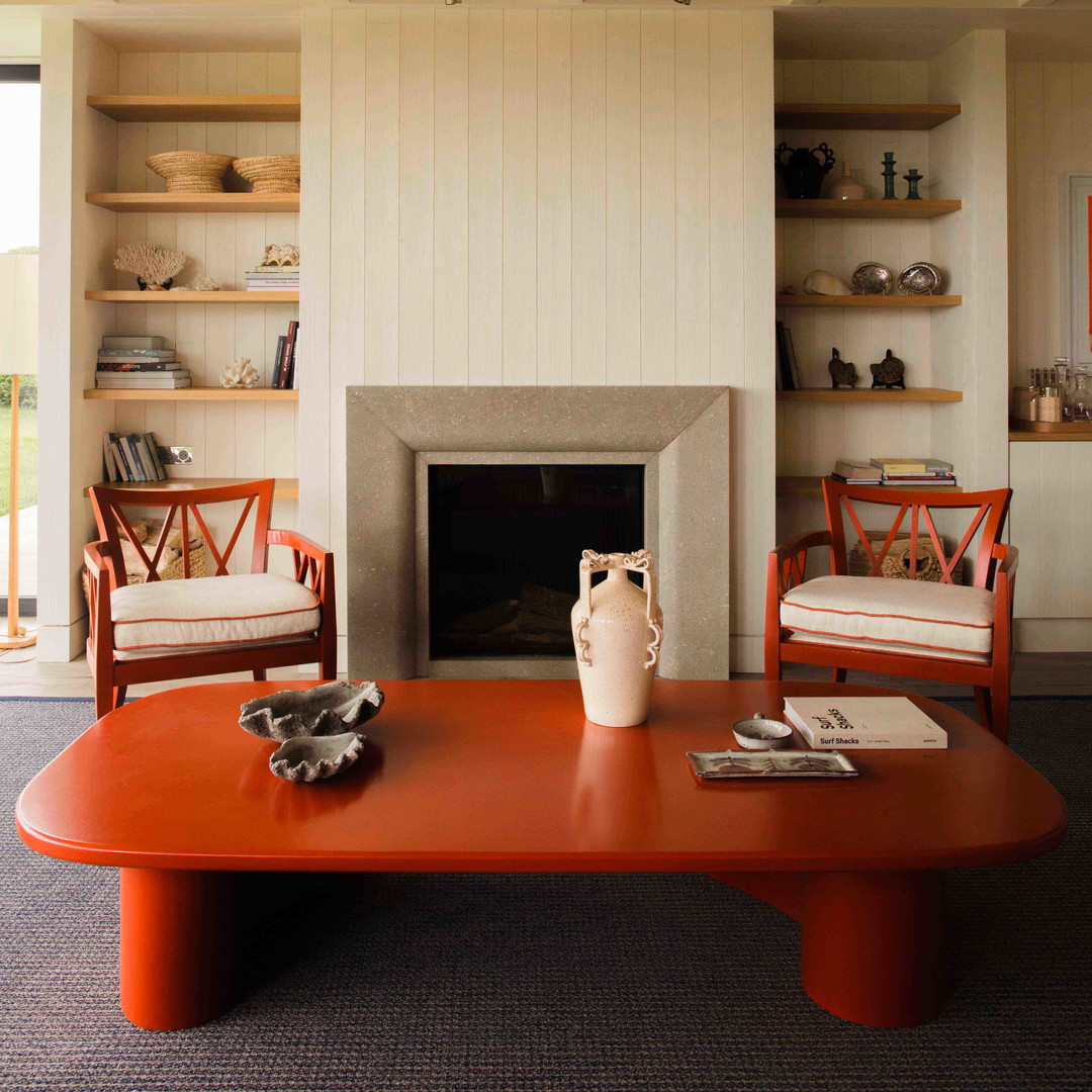 a living room filled with furniture and a fire place