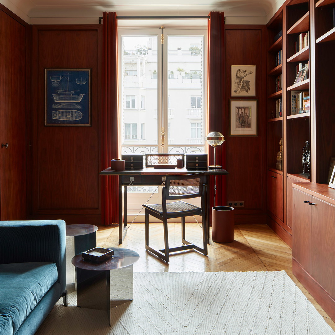 a living room filled with furniture and a large window