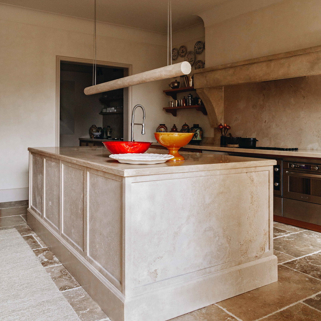 a kitchen with a sink and a stove top oven