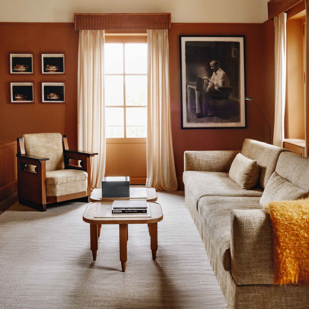 a living room filled with furniture and a window