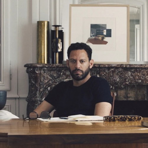 a man sitting at a desk in a room