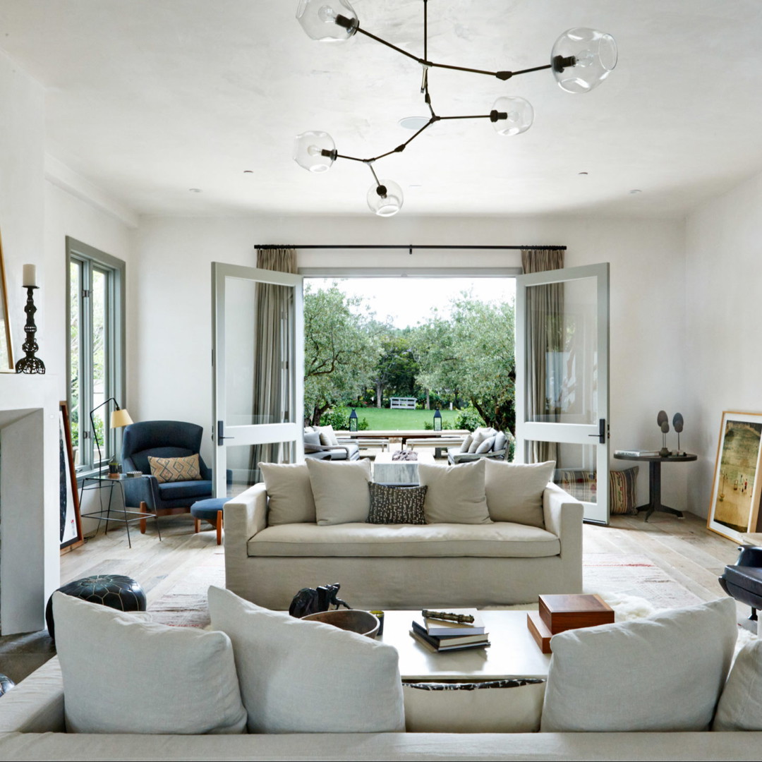 a living room filled with furniture and a fire place