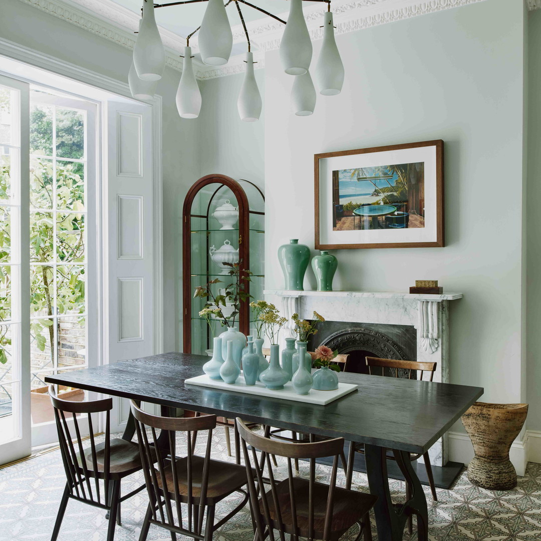 a dining room with a table and chairs