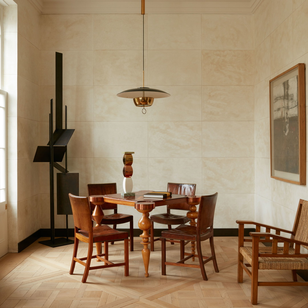 a dining room with a table and chairs