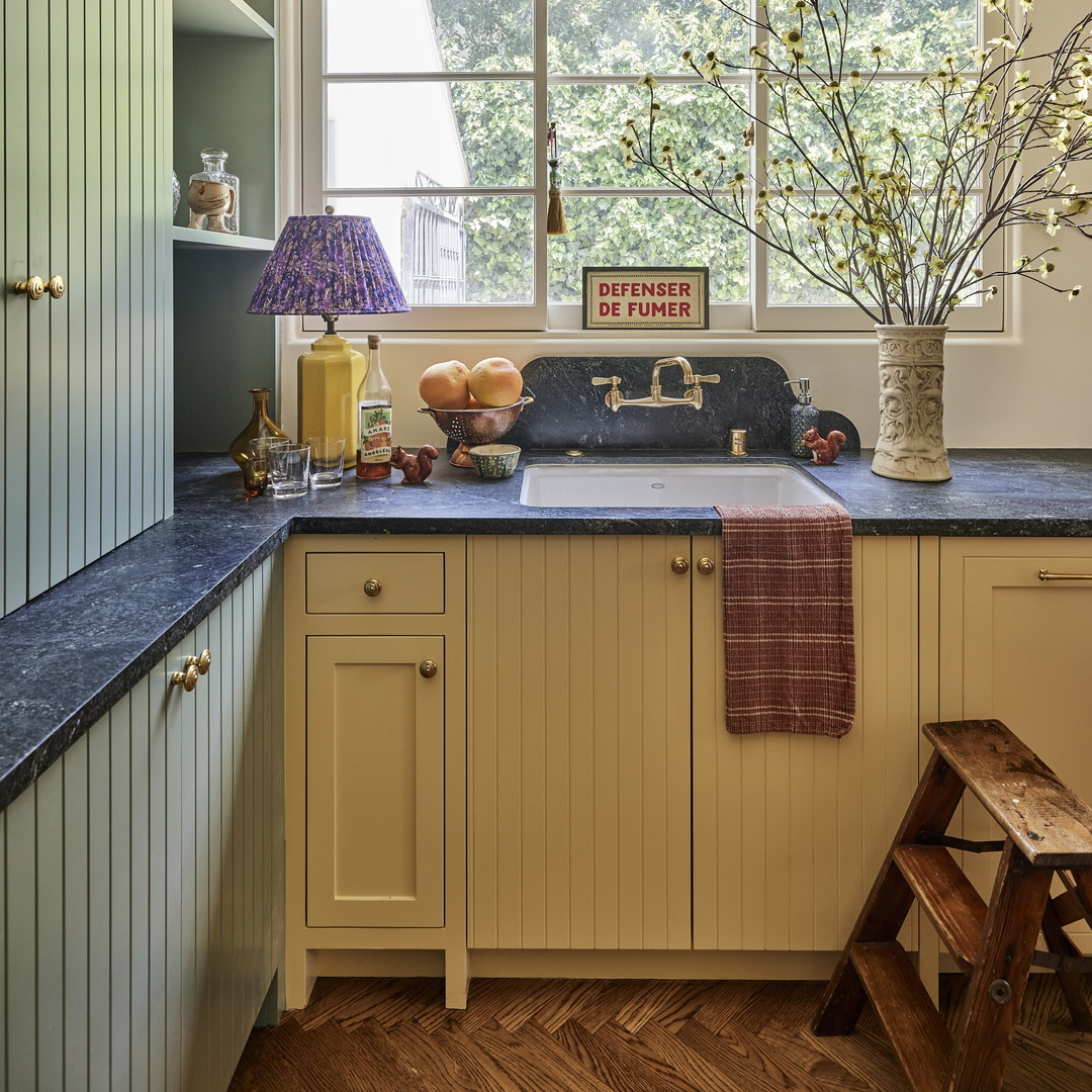 a kitchen with a sink and a window