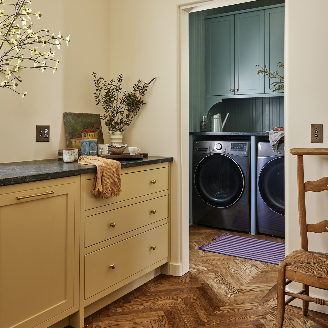 a kitchen with a washer and dryer in it