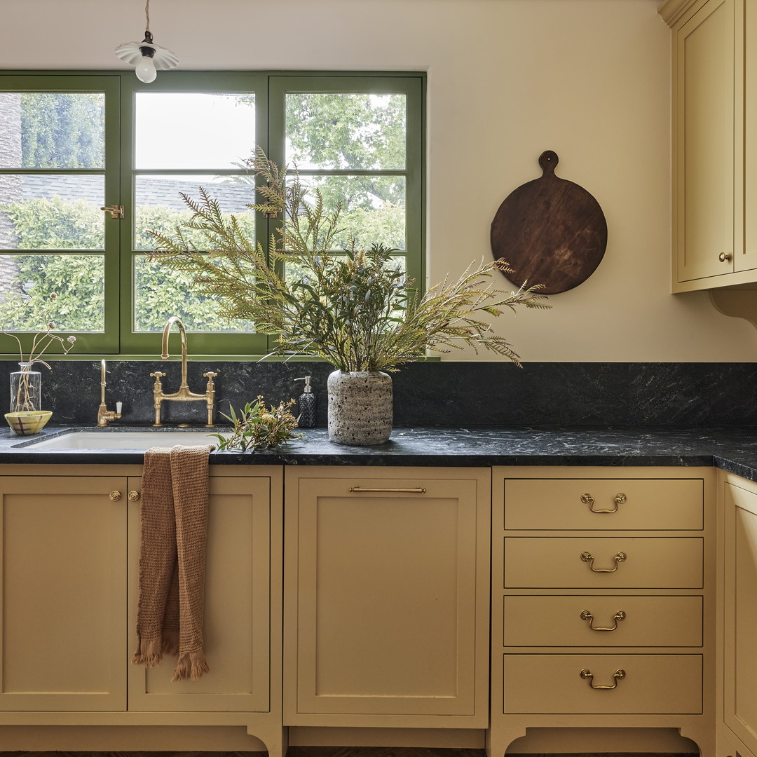 a kitchen with a sink and a window