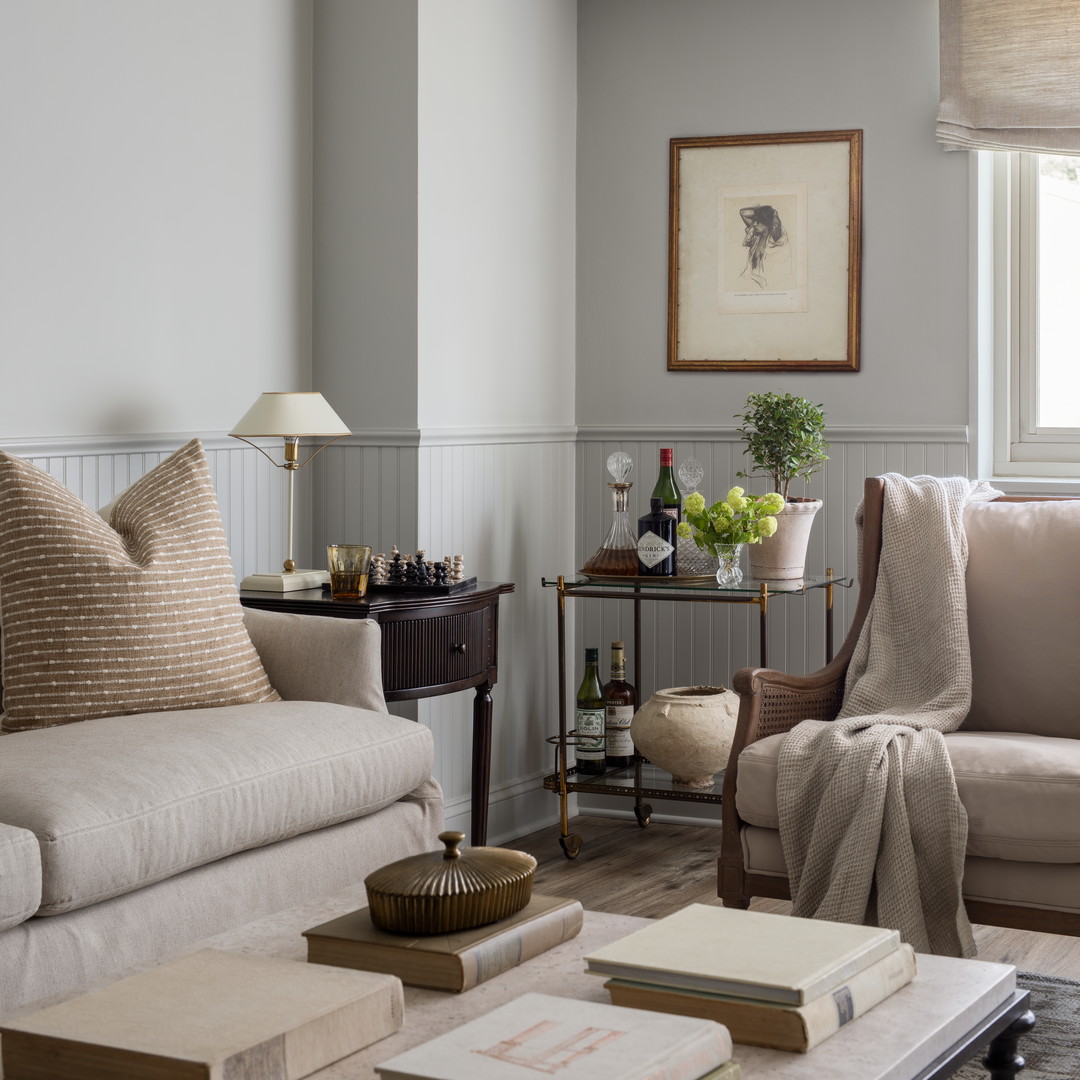 a living room filled with furniture and a window