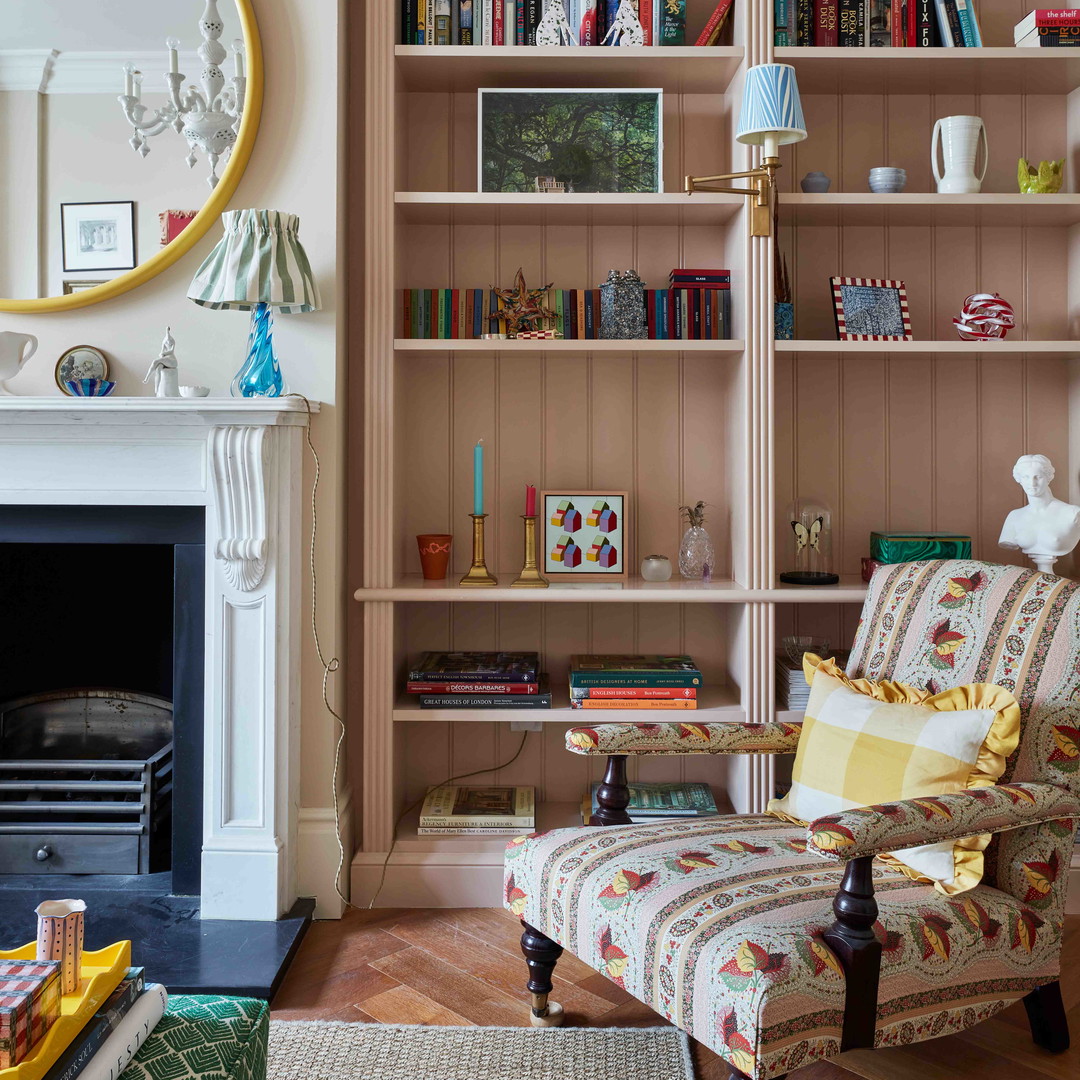 a living room filled with furniture and a fire place