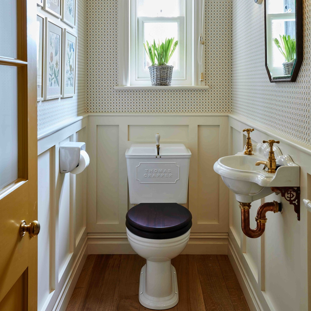 a bathroom with a toilet and a sink