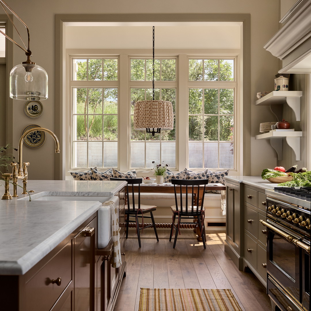 a kitchen with a table and chairs and a stove