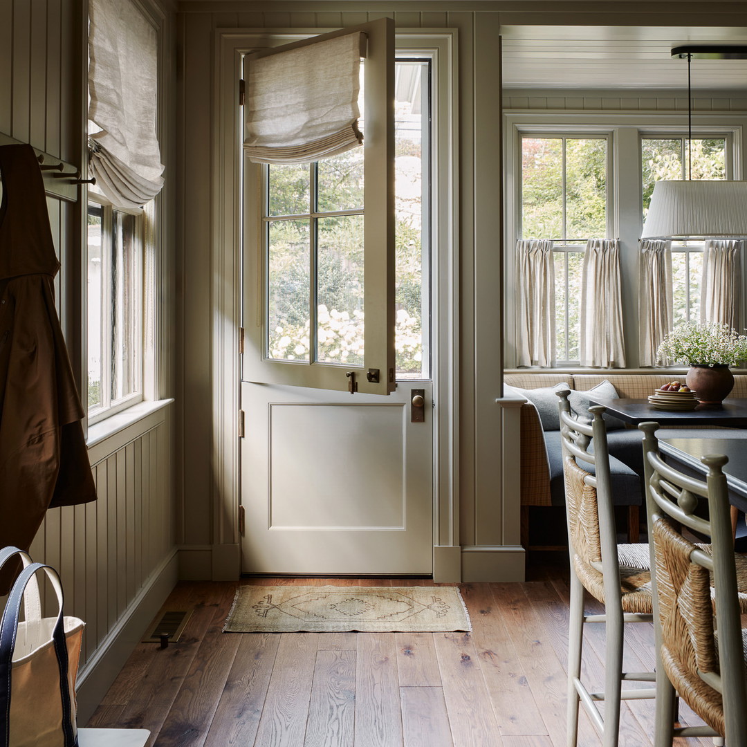 a dining room with a table and chairs