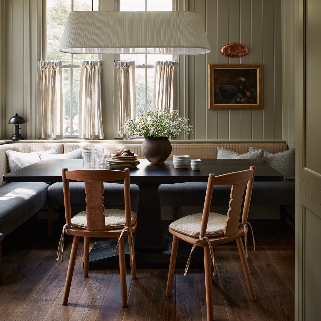 a living room with a couch a table and chairs