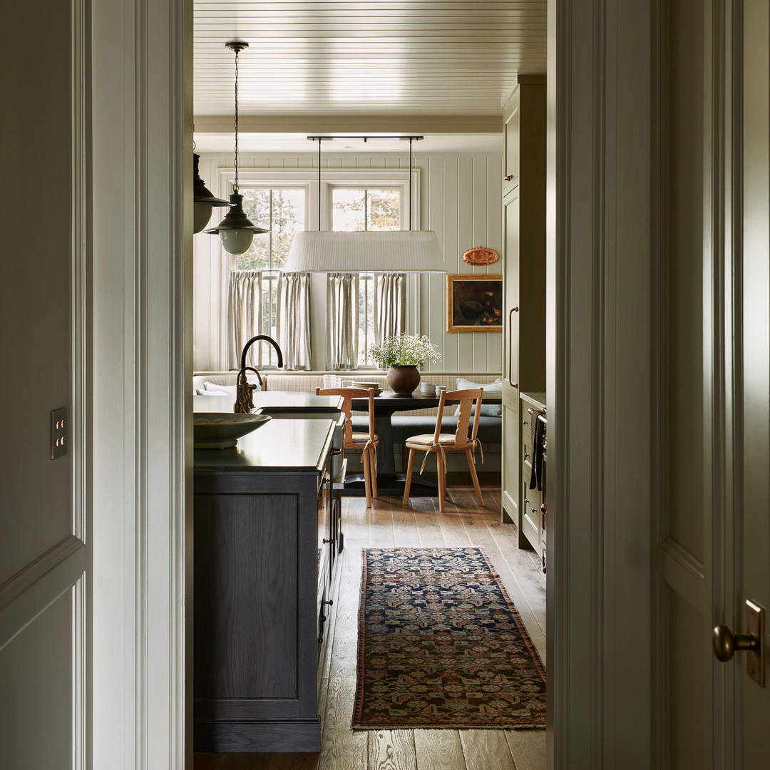 an open door leading to a kitchen and dining room