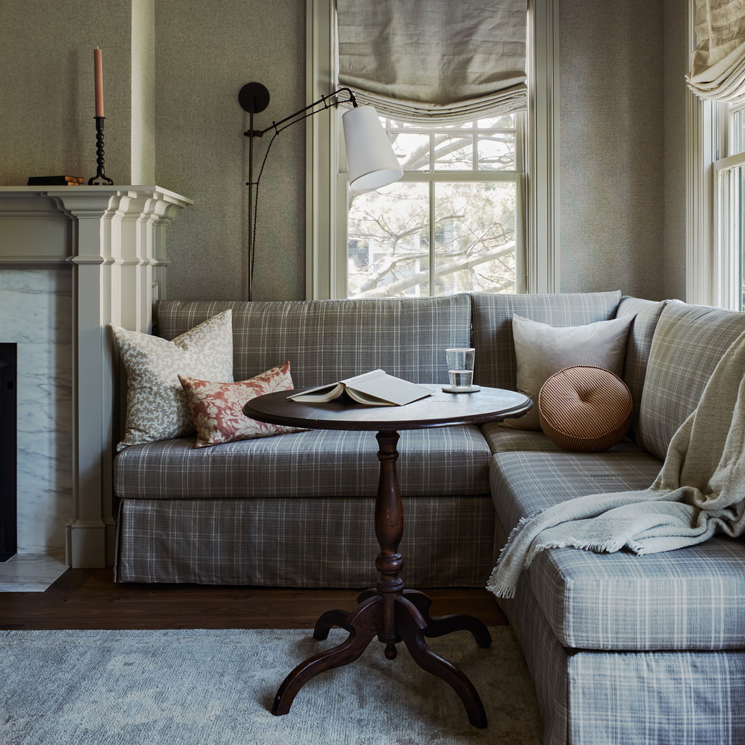 a living room filled with furniture and a fire place