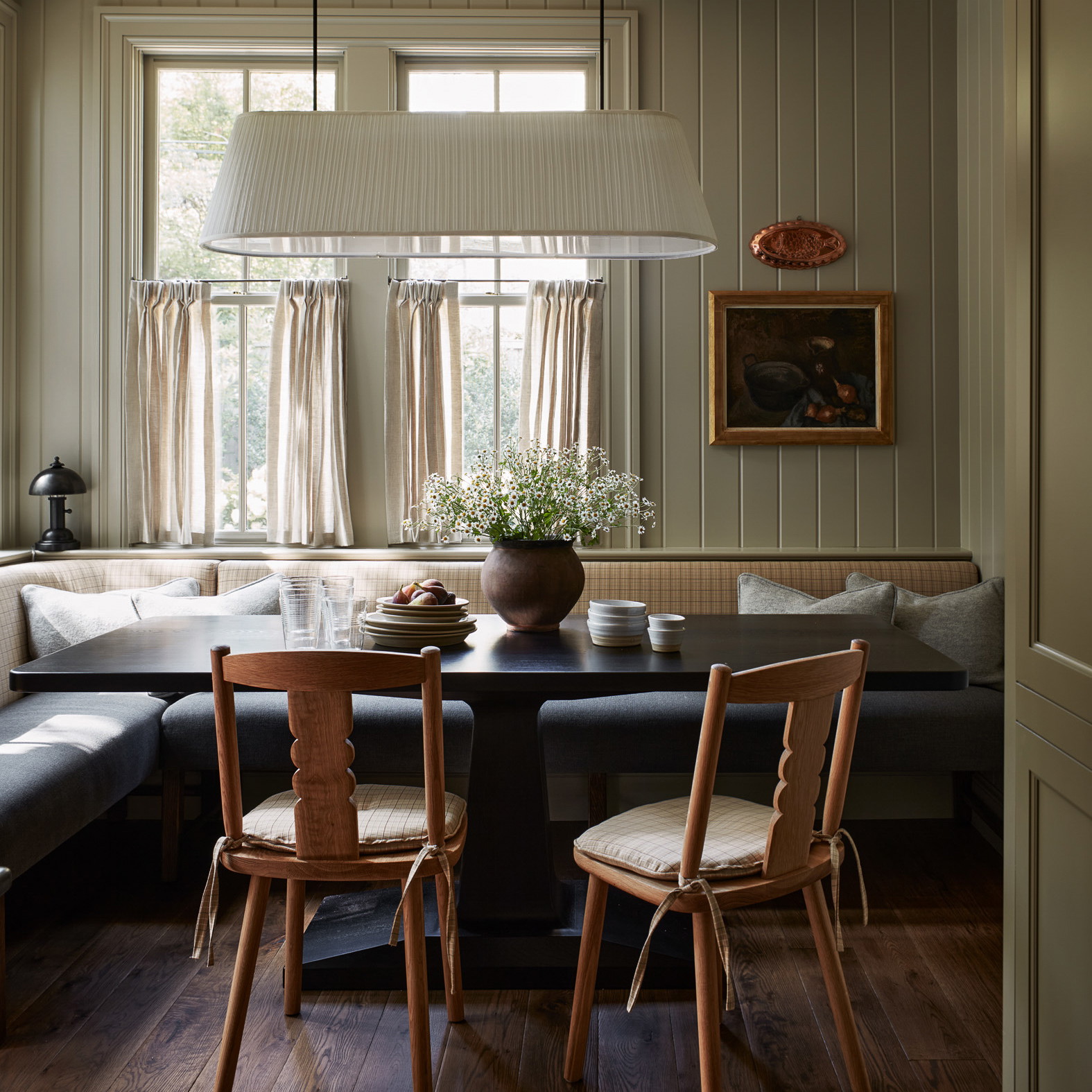 a living room with a couch a table and chairs