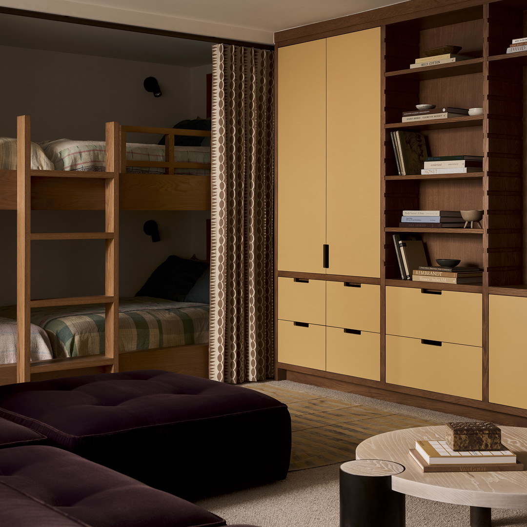 a living room filled with furniture and a book shelf