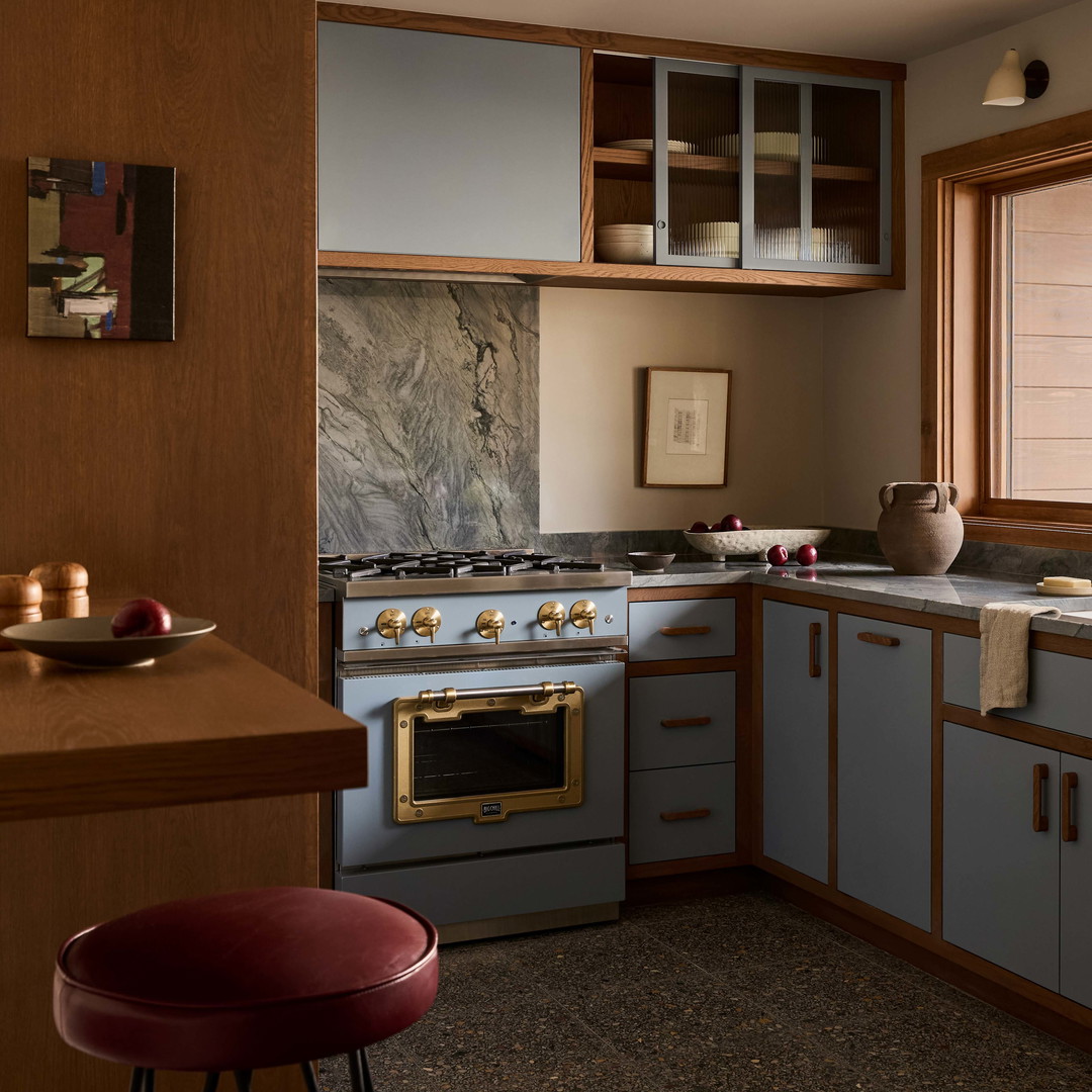 a kitchen with a stove top oven sitting next to a counter