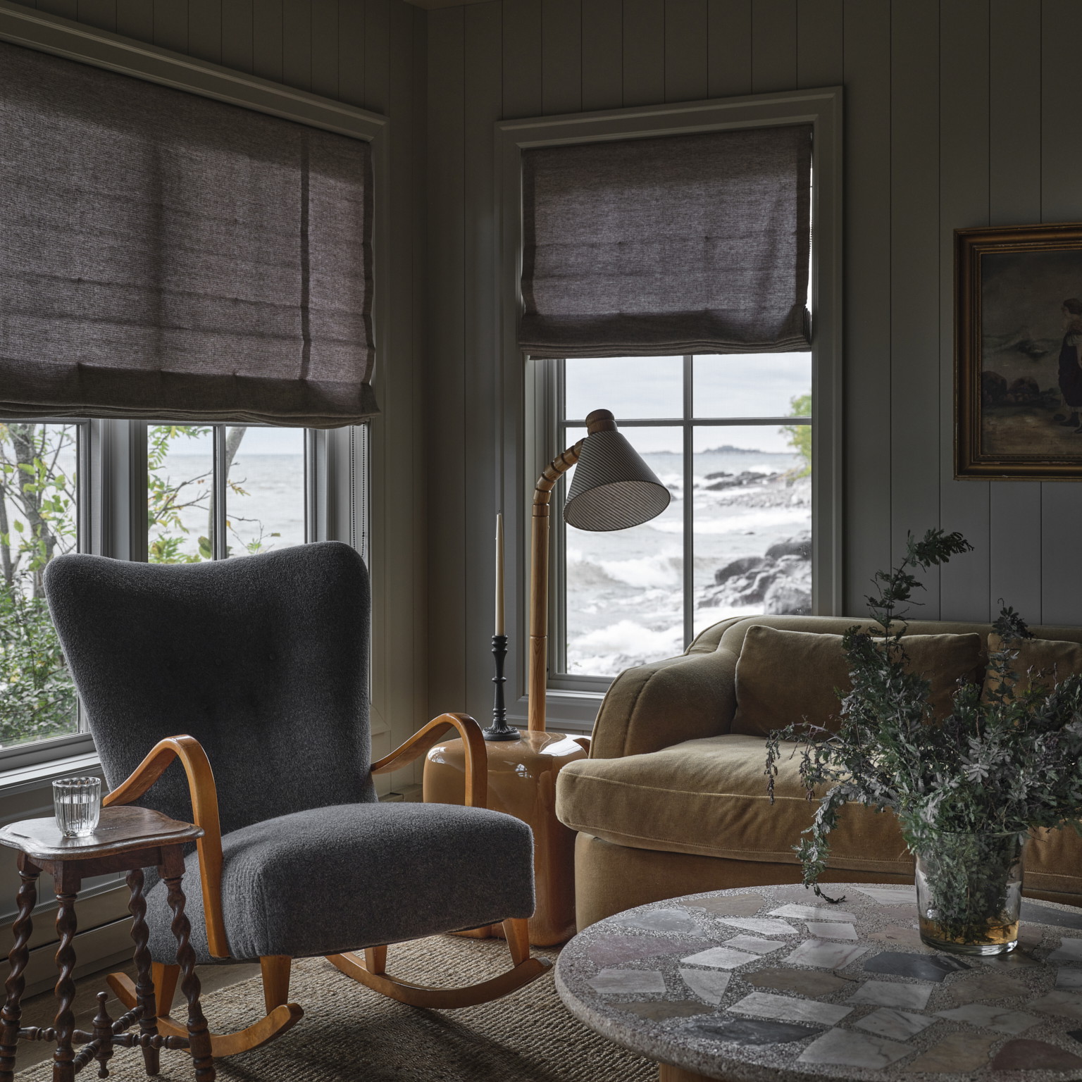 a living room filled with furniture and windows