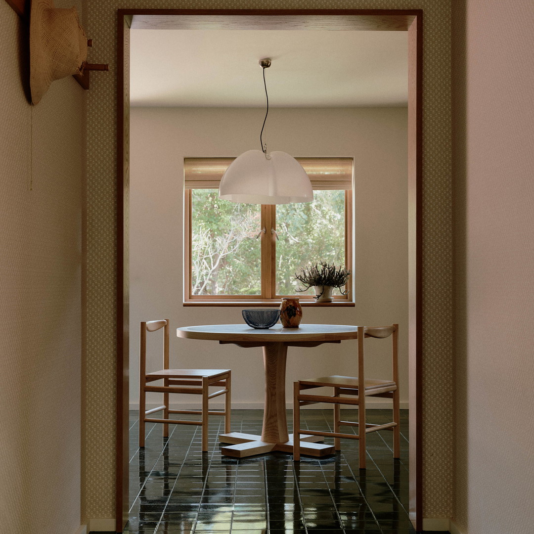 a dining room with a table and chairs