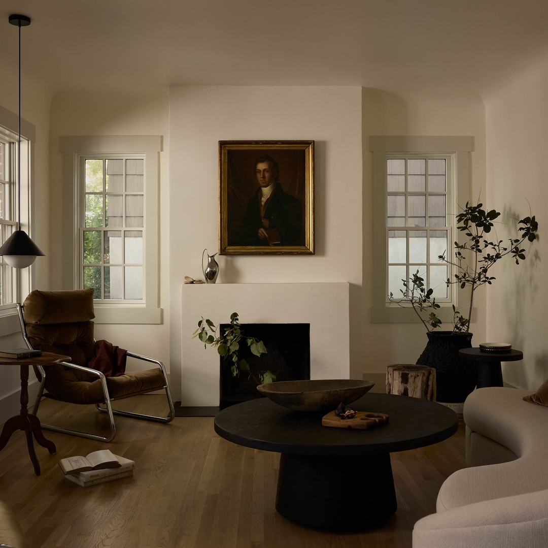 a living room filled with furniture and a fire place