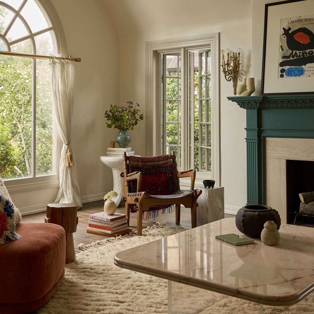 a living room filled with furniture and a fire place