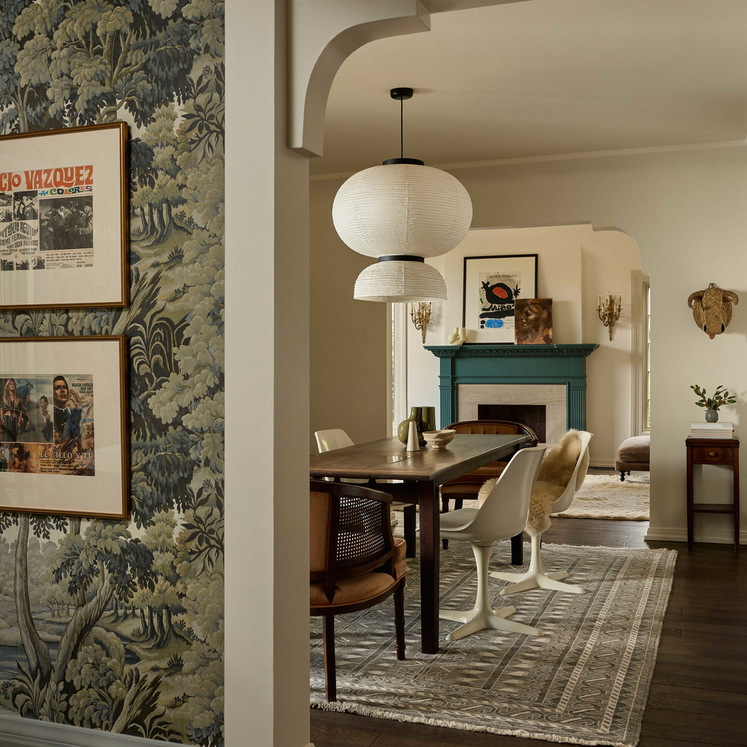 a dining room with a table and chairs