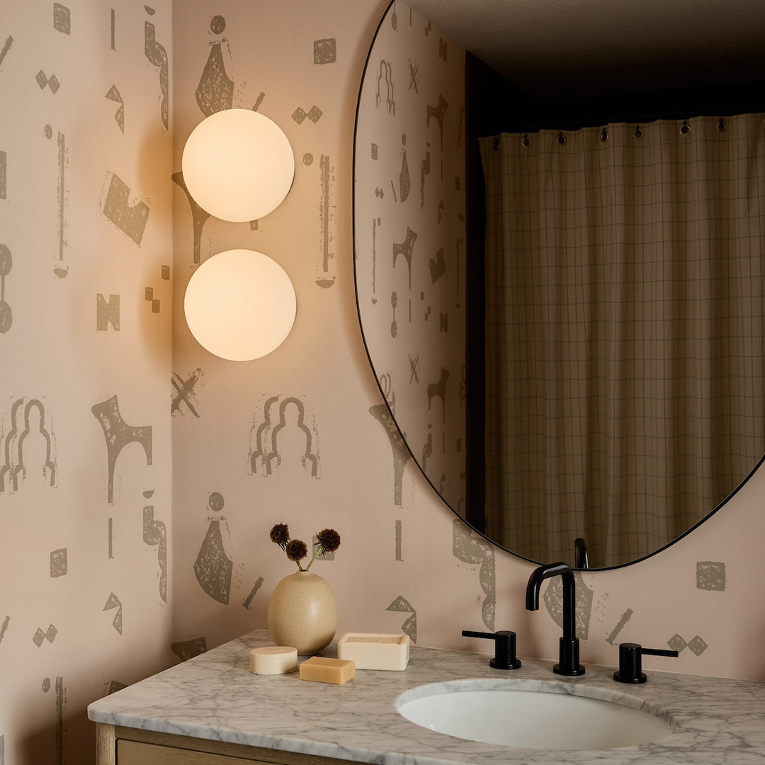 a bathroom vanity with a mirror and a sink