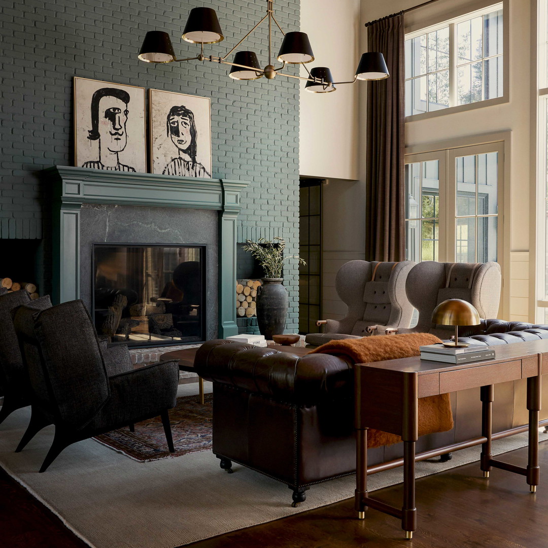 a living room filled with furniture and a fire place