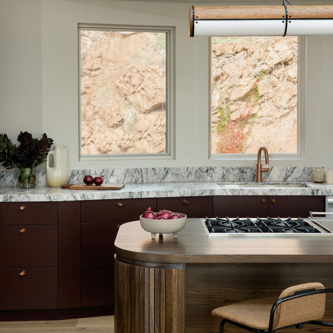 a kitchen with a stove top oven next to a counter