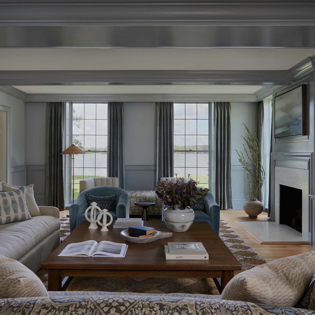 a living room filled with furniture and a fire place