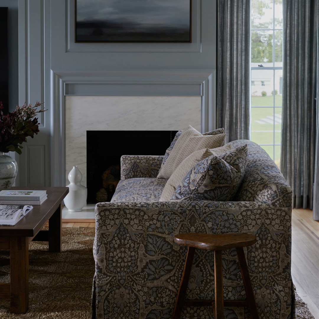 a living room filled with furniture and a fire place