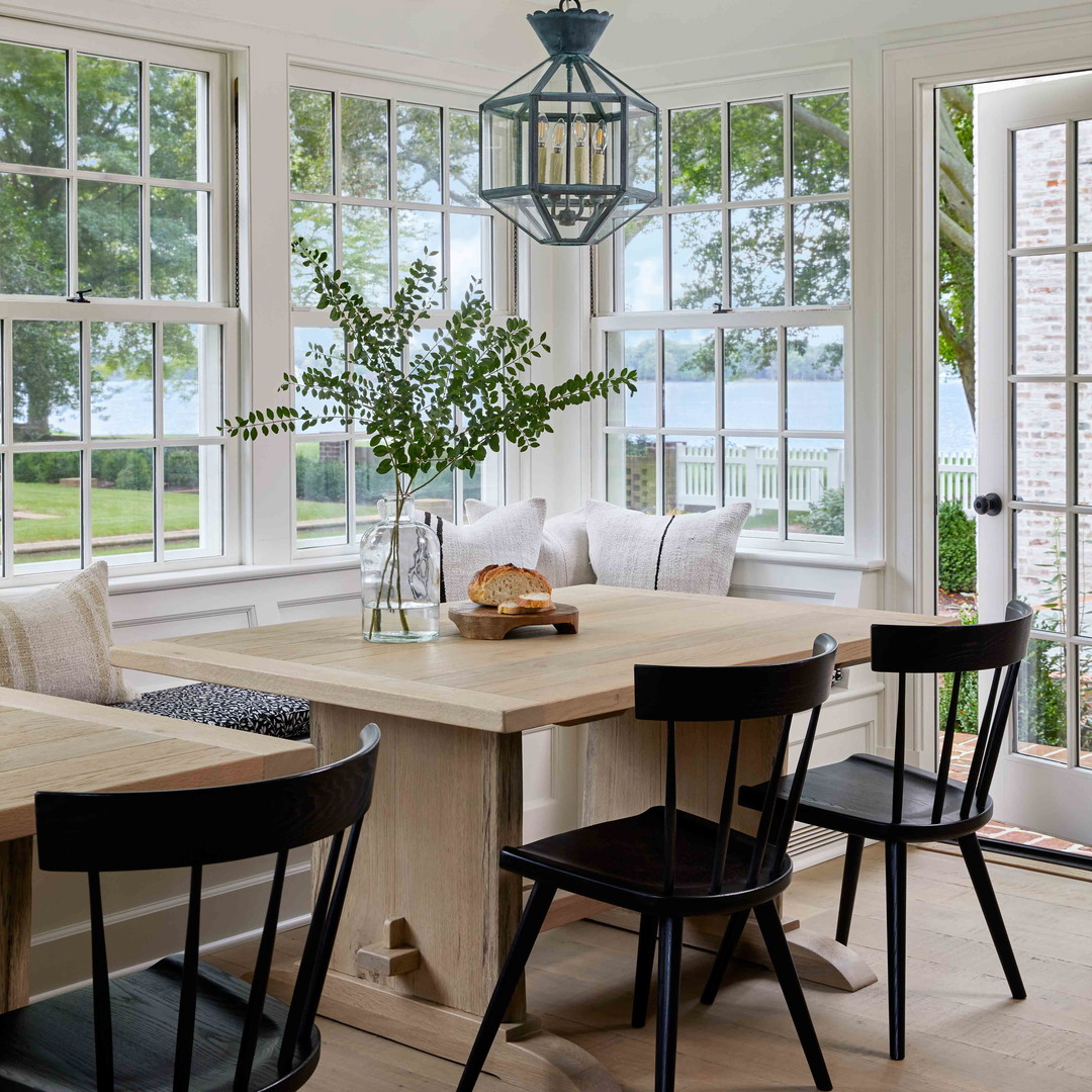 a dining room with a table and chairs