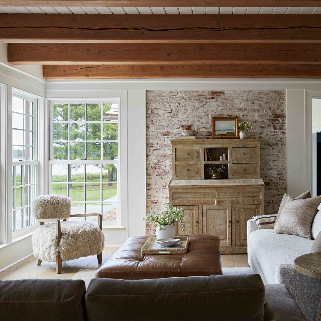 a living room filled with furniture and a fire place