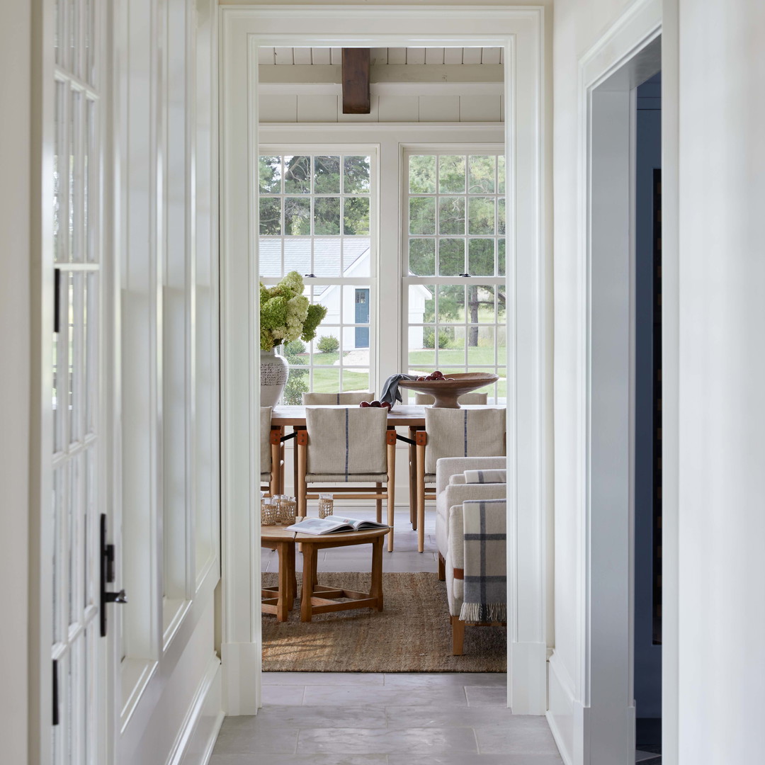 a hallway leading to a dining room and living room