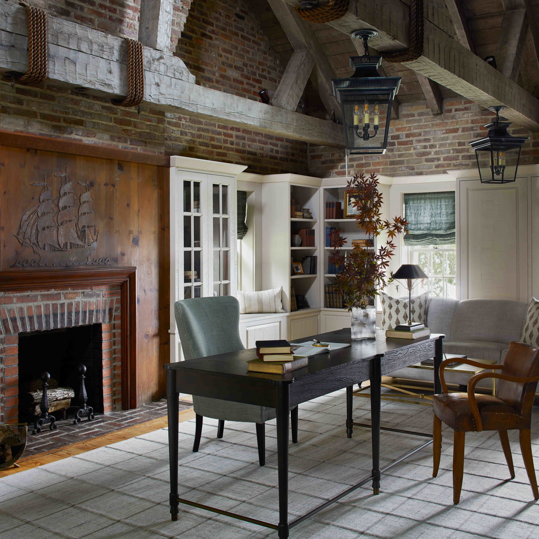 a living room filled with furniture and a fire place