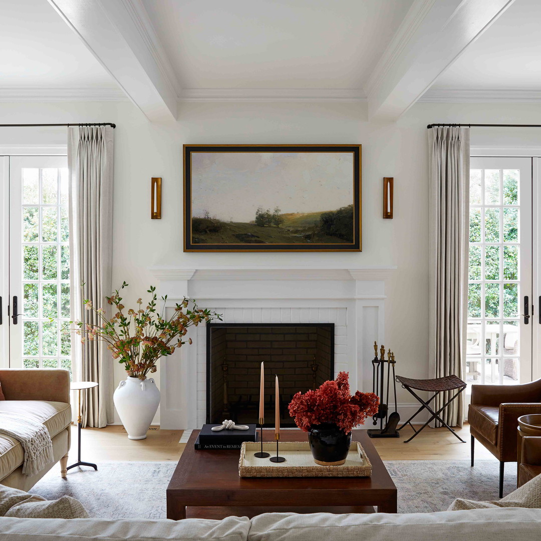 a living room filled with furniture and a fire place