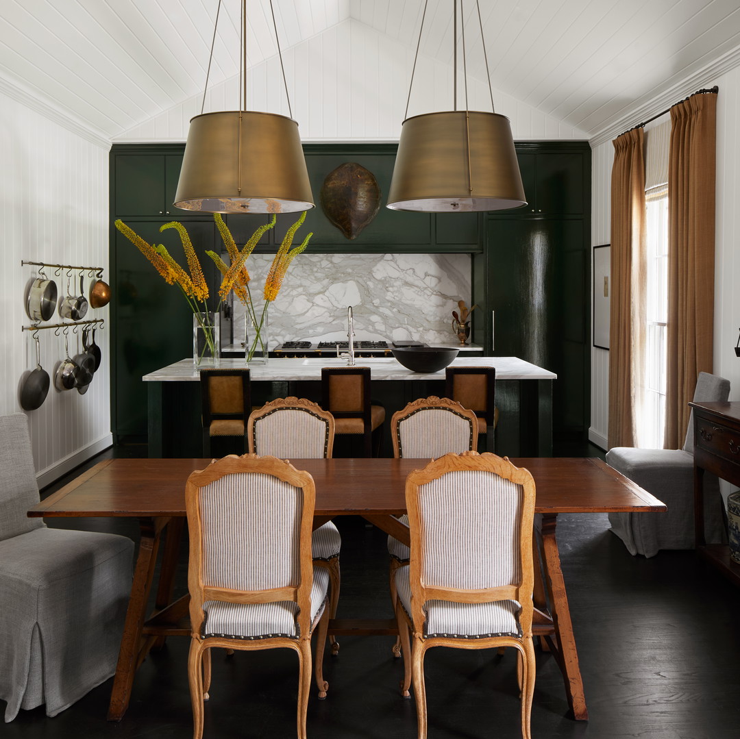 a dining room with a table and chairs