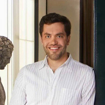 a man standing in a doorway of a house