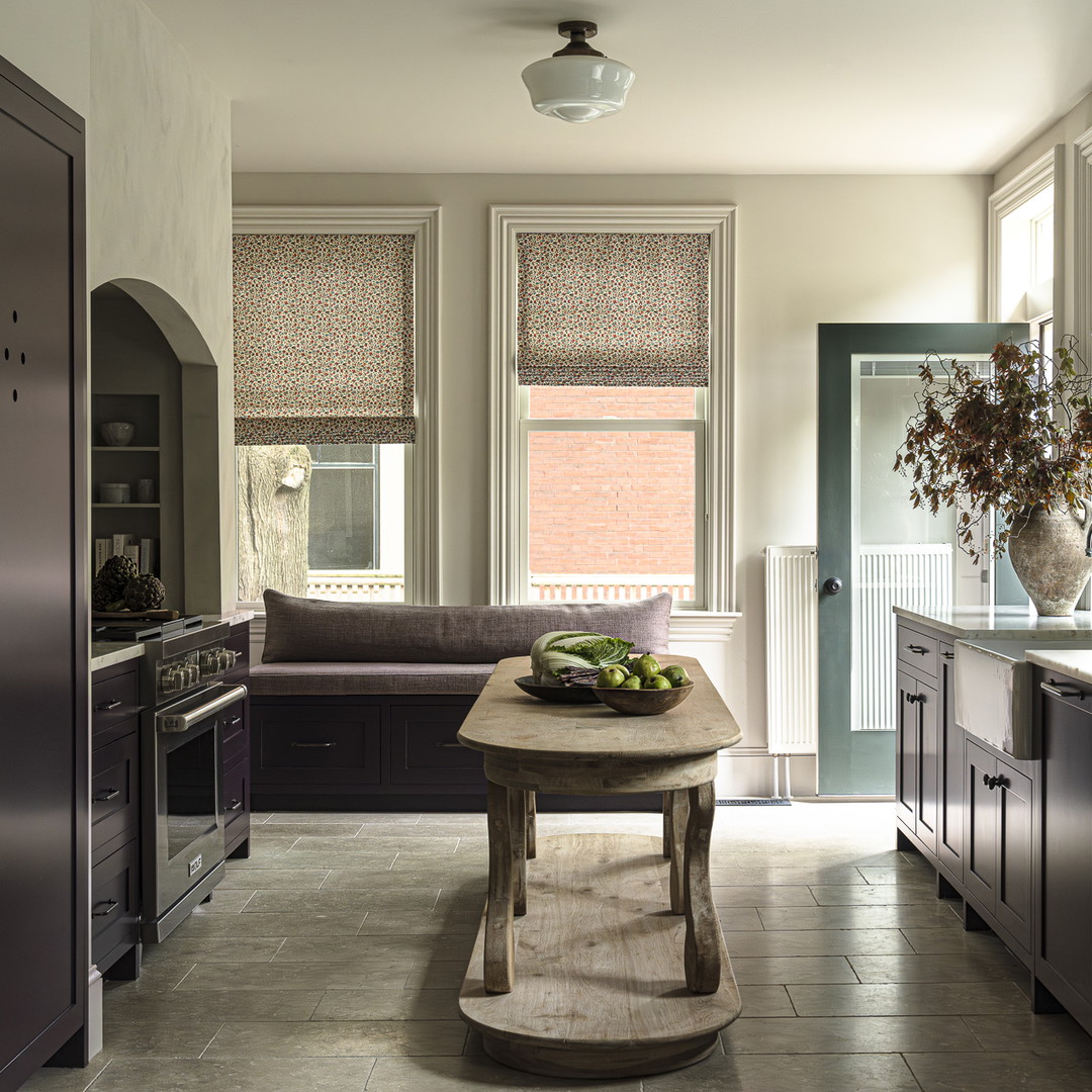 a kitchen with a table in the middle of it