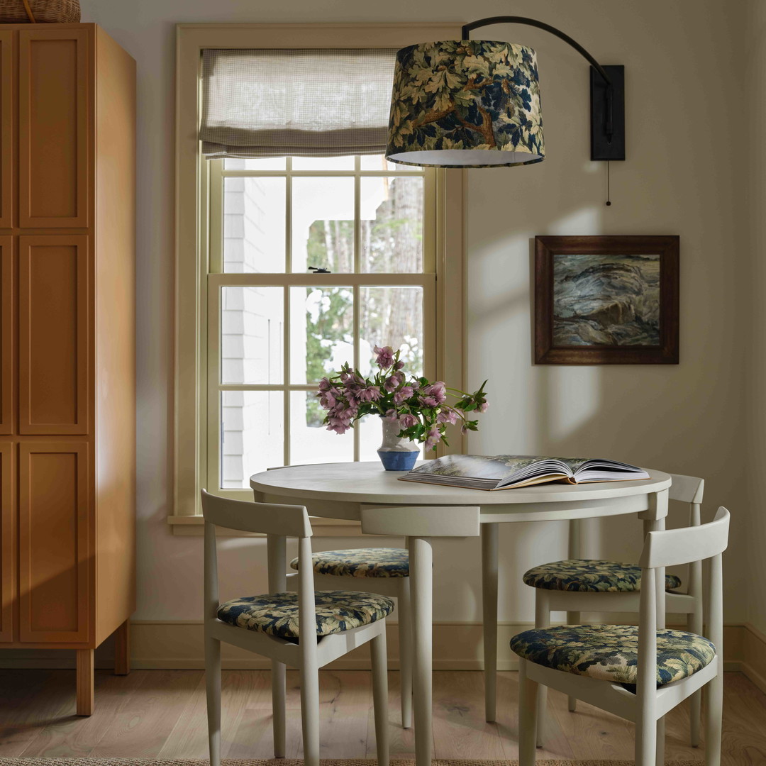 a white table and chairs in a room