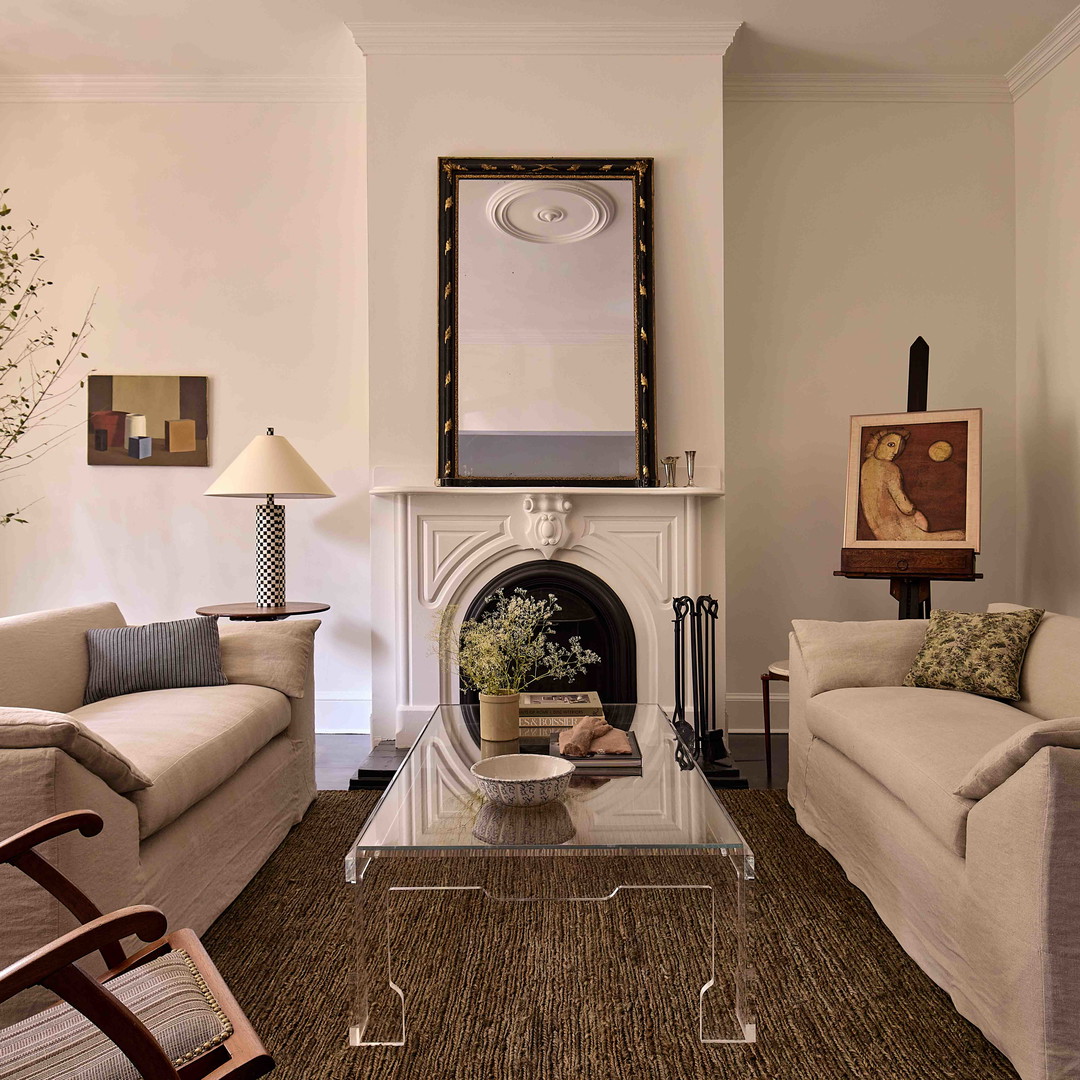 a living room filled with furniture and a fire place